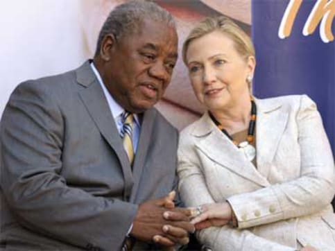 Clinton aims at Gaddafi, shoots from Africa shoulder Clinton aims at Gaddafi, shoots from Africa shoulder