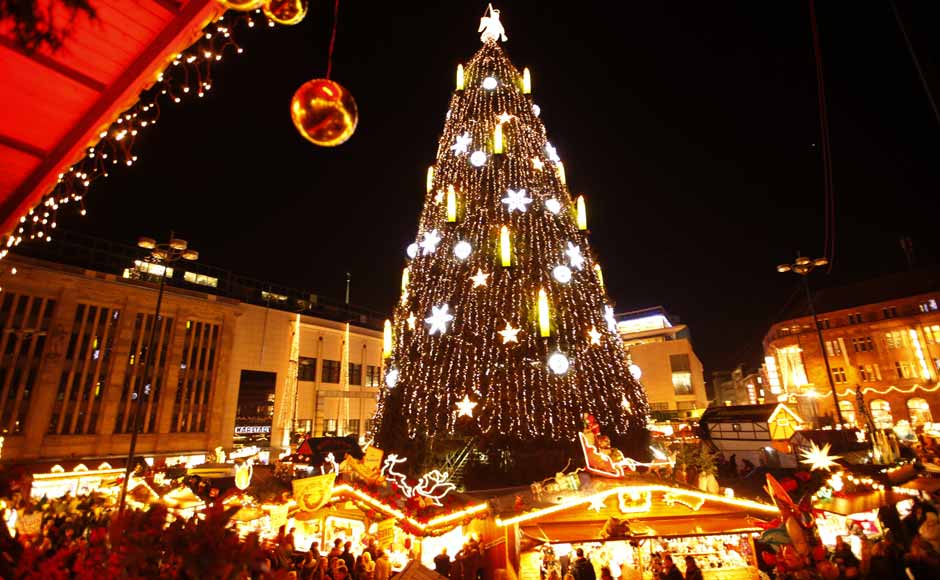A decorated Christmas tree is lighted up at a Christmas market on its opening day in Dortmund.The Christmas tree of Dortmund is the largest in the world and is built with a scaffold, covered with 1,700 Norway spruces, 40,000 lights and is 45m (148 ft) high. Reuters A decorated Christmas tree is lighted up at a Christmas market on its opening day in Dortmund.The Christmas tree of Dortmund is the largest in the world and is built with a scaffold, covered with 1,700 Norway spruces, 40,000 lights and is 45m (148 ft) high. Reuters