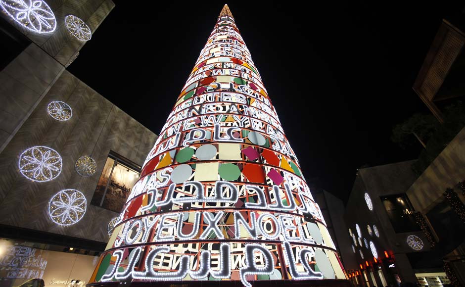 A Christmas tree with words "Merry Christmas and Happy New Year" in many languages is erected for the upcoming Christmas at Beirut. Reuters A Christmas tree with words "Merry Christmas and Happy New Year" in many languages is erected for the upcoming Christmas at Beirut. Reuters