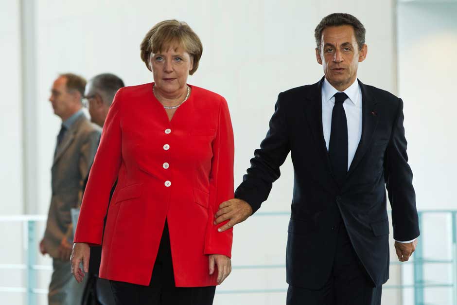 Sarkozy to Merkel: Let me handle this one. AP Sarkozy to Merkel: Let me handle this one. AP