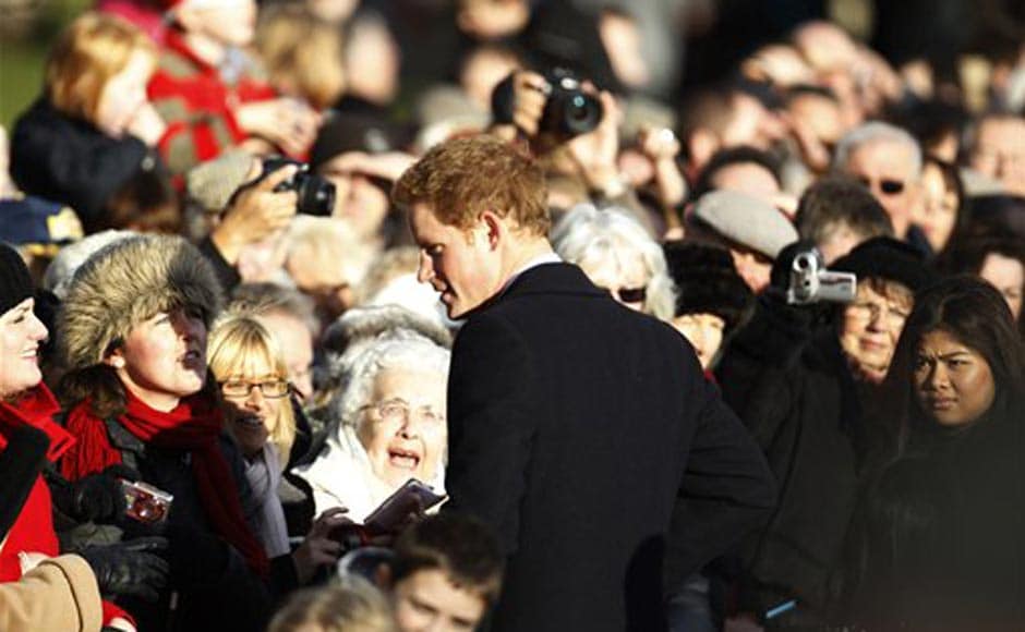 Britain's Prince Harry talks to well wishers after he and other members of Britain's royal family attended a Christmas Service at St. Mary's church in the grounds of Sandringham Estate, the Queen's Norfolk retreat, England. AP Britain's Prince Harry talks to well wishers after he and other members of Britain's royal family attended a Christmas Service at St. Mary's church in the grounds of Sandringham Estate, the Queen's Norfolk retreat, England. AP