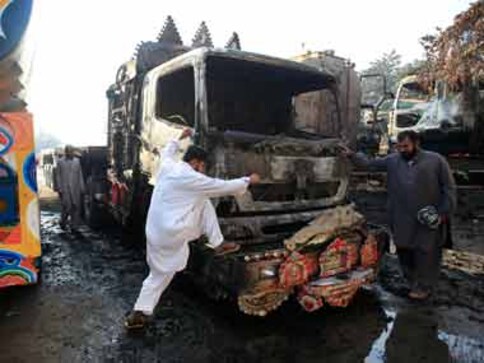 Pakistan to reopen route, will now charge NATO for passage