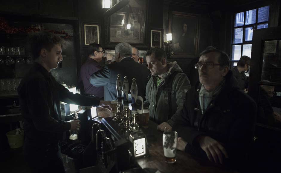 Patrons drink at Ye Olde Cheshire Cheese pub, one of London's oldest pubs and one of Charles Dickens favourites, alluded to in A Tale of Two Cities, London. Reuters Patrons drink at Ye Olde Cheshire Cheese pub, one of London's oldest pubs and one of Charles Dickens favourites, alluded to in A Tale of Two Cities, London. Reuters