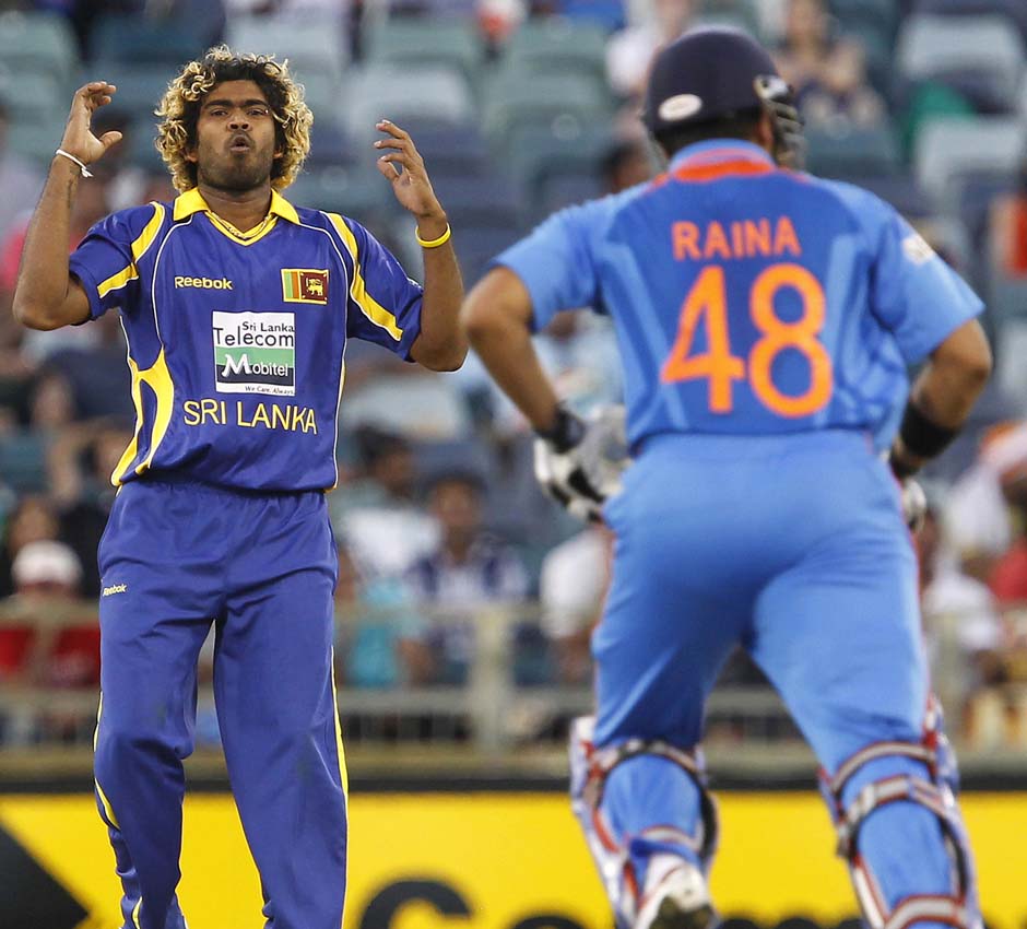 Sri Lanka's Lasith Malinga, left, shows some emotion after bowling the ball against India. AP Photo Sri Lanka's Lasith Malinga, left, shows some emotion after bowling the ball against India. AP Photo