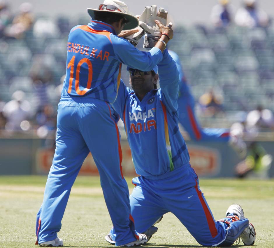 India's Sachin Tendulkar, left, congratulates Mahendra Dhoni after Sri Lanka's Kumar Sangakkara was caught behind during their one day international cricket match at the WACA. AP Photo India's Sachin Tendulkar, left, congratulates Mahendra Dhoni after Sri Lanka's Kumar Sangakkara was caught behind during their one day international cricket match at the WACA. AP Photo