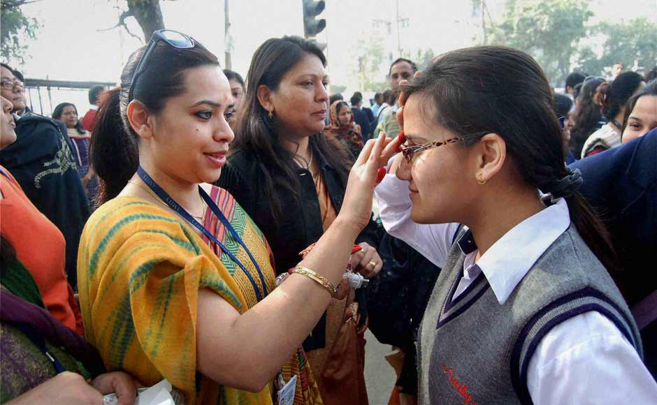Teachers wishing good luck to students at an examination centre before they appear in their 10th standard exams of CBSE in Noida on Thursday. PTI Teachers wishing good luck to students at an examination centre before they appear in their 10th standard exams of CBSE in Noida on Thursday. PTI