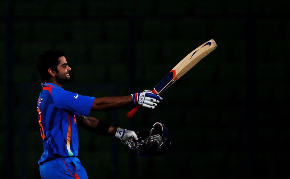 Virat Kohli raises his bat on reaching his century during the opening game of the 2011 World Cup between Bangladesh and India at the Shere-e-Bangla National Stadium in Bangladesh. Getty Images Virat Kohli raises his bat on reaching his century during the opening game of the 2011 World Cup between Bangladesh and India at the Shere-e-Bangla National Stadium in Bangladesh. Getty Images