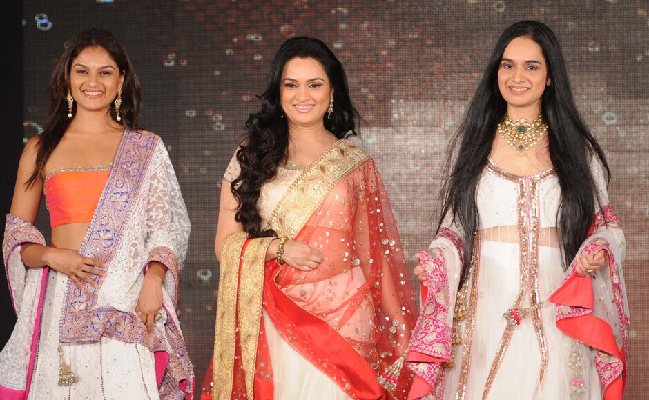 Padmini Kolhapure (centre) walks the ramp with sisters Tejaswini Kolhapure (right) and Shivangi Kapoor for the fundraiser. Raju Shelar/Firstpost Padmini Kolhapure (centre) walks the ramp with sisters Tejaswini Kolhapure (right) and Shivangi Kapoor for the fundraiser. Raju Shelar/Firstpost