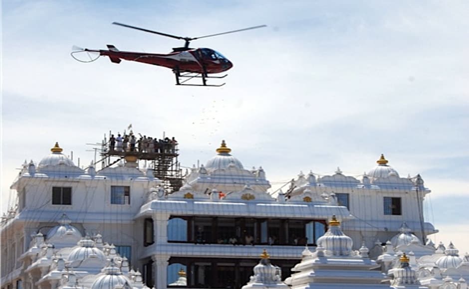 A helicopter showering flowers on the temple at the consecration ceremony. Firstpost A helicopter showering flowers on the temple at the consecration ceremony. Firstpost