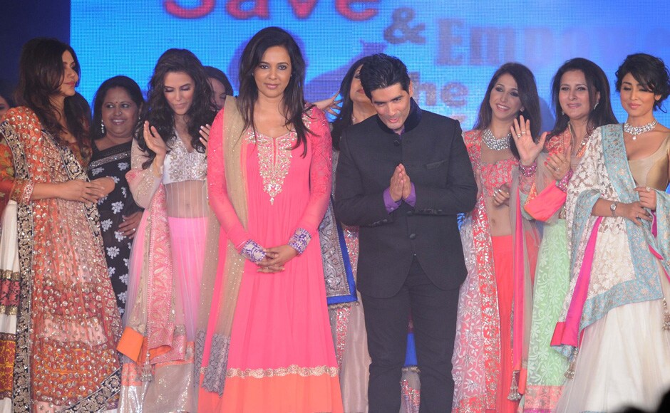 Manish Malhotra bows to the audience during the fashion show. On his right is Sunita Menon. Raju Shelar/Firstpost Manish Malhotra bows to the audience during the fashion show. On his right is Sunita Menon. Raju Shelar/Firstpost