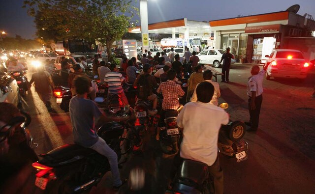There's a traffic jam outside the petrol pump: Motorcyclists form a line outside of a fuel station as they queue to fill up on petrol in Ahmedabad. Reuters There's a traffic jam outside the petrol pump: Motorcyclists form a line outside of a fuel station as they queue to fill up on petrol in Ahmedabad. Reuters