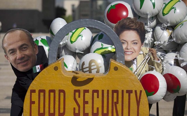 Oxfam activists wear masks depicting Mexico's President Felipe Calderon, left, and Brazil’s President Dilma Rousseff as they demonstrate in Mexico City. Alexandre Meneghini/AP Oxfam activists wear masks depicting Mexico's President Felipe Calderon, left, and Brazil’s President Dilma Rousseff as they demonstrate in Mexico City. Alexandre Meneghini/AP
