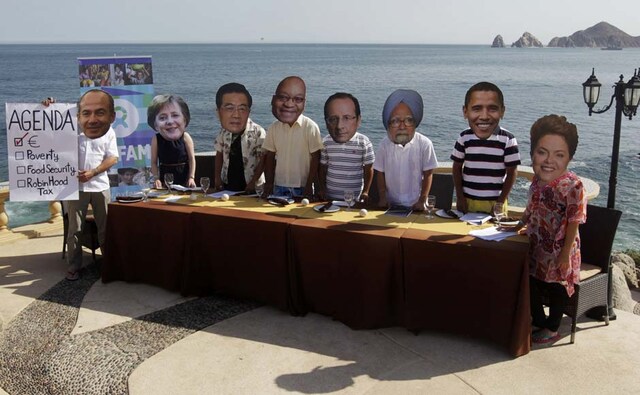 Oxfam activists wear masks representing some of the G20 world leaders along the shore in Los Cabos. Andres Stapff/Reuters Oxfam activists wear masks representing some of the G20 world leaders along the shore in Los Cabos. Andres Stapff/Reuters