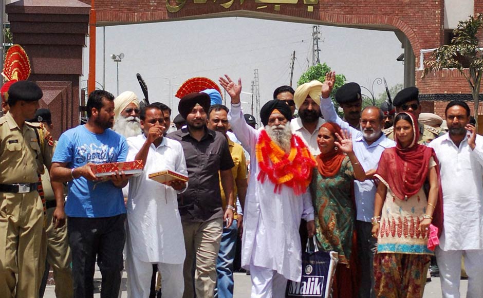 Surjit Singh is greeted by his family and relatives on his arrival at the Indian side of Attari-Wagah border on Thursday after being released by the Pakistani authorities. PTI Surjit Singh is greeted by his family and relatives on his arrival at the Indian side of Attari-Wagah border on Thursday after being released by the Pakistani authorities. PTI