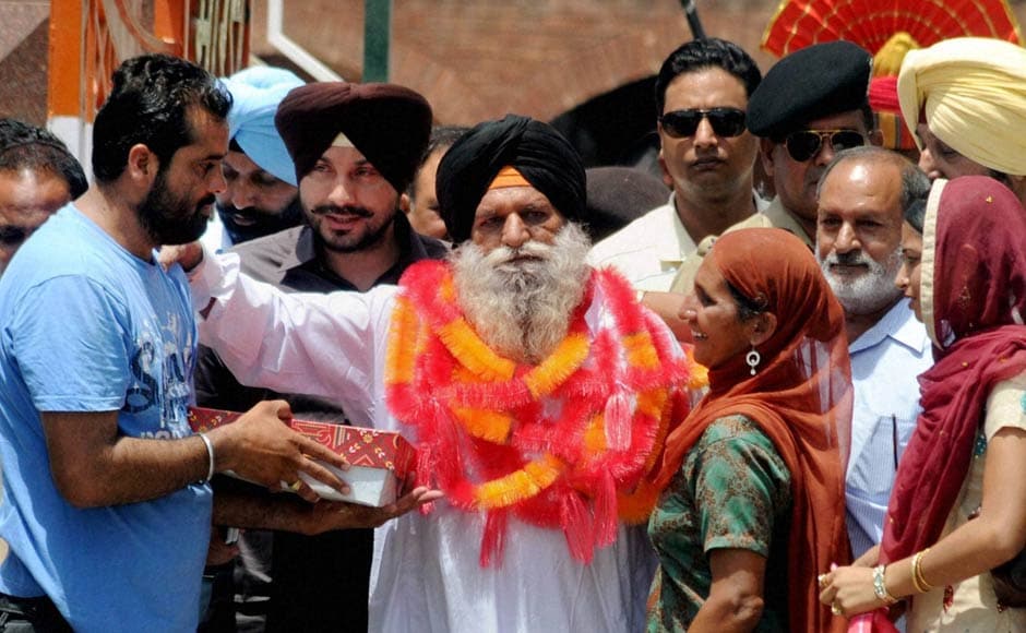 Surjit Singh is greeted by his family and relatives on his arrival at the Indian side of Attari-Wagah border after being released by the Pakistani authorities. PTI Surjit Singh is greeted by his family and relatives on his arrival at the Indian side of Attari-Wagah border after being released by the Pakistani authorities. PTI