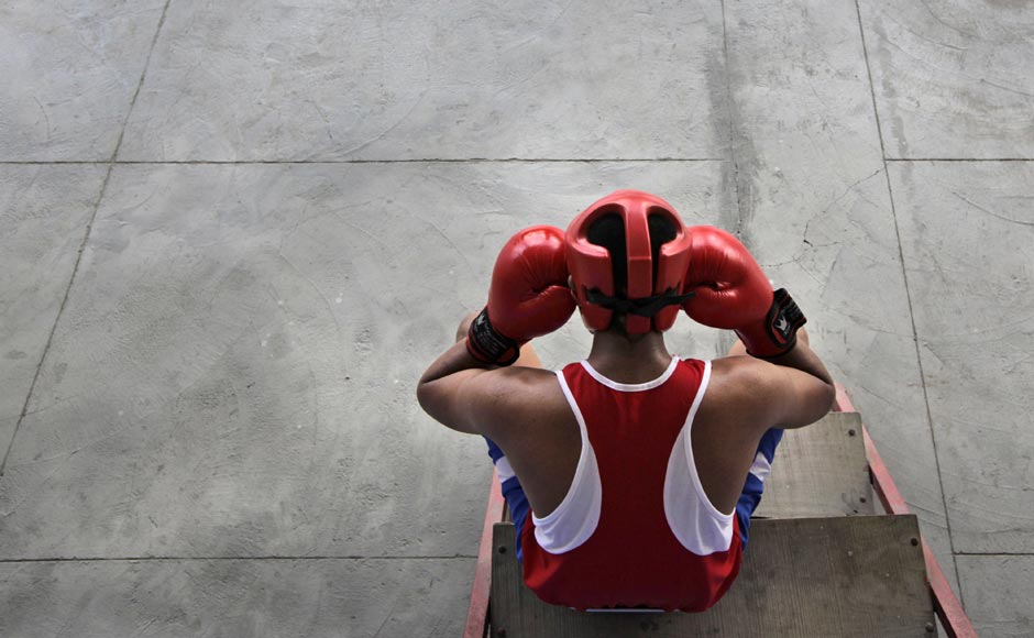 An amateur boxer takes a break during a practice session at the Bhiwani Boxing Club in Bhiwani, 122 kilometers west from New Delhi. The sleepy northern Indian town of Bhiwani is considered a mini Cuba, with dozens of boxers fighting it out hard in top national and international competitions. AP An amateur boxer takes a break during a practice session at the Bhiwani Boxing Club in Bhiwani, 122 kilometers west from New Delhi. The sleepy northern Indian town of Bhiwani is considered a mini Cuba, with dozens of boxers fighting it out hard in top national and international competitions. AP