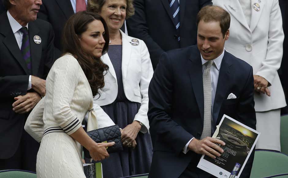 Britain's Prince William, right, and his wife Kate, Duchess of Cambridge applaud ahead of a quarterfinals match between Roger Federer of Switzerland and Mikhail Youzhny of Russia. AP Britain's Prince William, right, and his wife Kate, Duchess of Cambridge applaud ahead of a quarterfinals match between Roger Federer of Switzerland and Mikhail Youzhny of Russia. AP