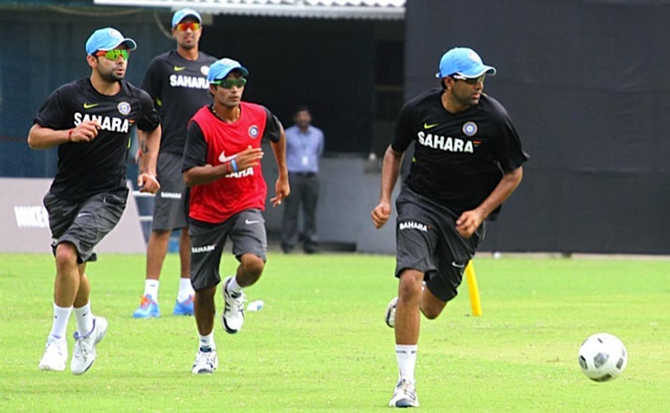 Virat Kohli, Ashok Dinda and R Ashwin during practice. Firstpost Virat Kohli, Ashok Dinda and R Ashwin during practice. Firstpost