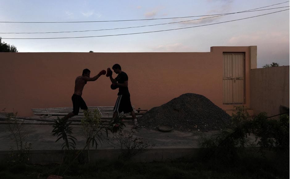 A boxer practices punching at the Bhiwani Boxing Club in Bhiwani.AP A boxer practices punching at the Bhiwani Boxing Club in Bhiwani.AP