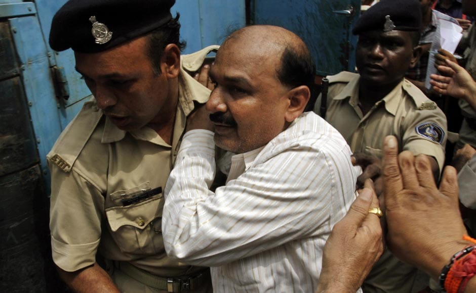 Former Bajrang Dal leader Babu Bajrangi, center, is escorted by policemen on his arrival at a special court in Ahmedabad, ahead of the sentencing for 2002 Naroda Patiya massacre . AP Former Bajrang Dal leader Babu Bajrangi, center, is escorted by policemen on his arrival at a special court in Ahmedabad, ahead of the sentencing for 2002 Naroda Patiya massacre . AP