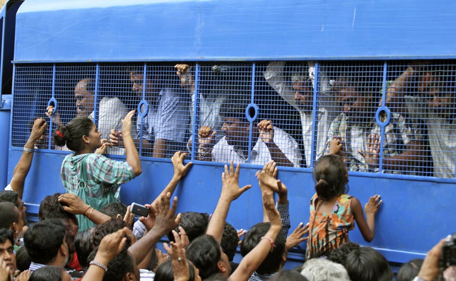 Relatives crowd around a police vehicle carrying convicts after a special court in Ahmedabad found them guilty of 2002 Naroda Patiya massacre on 29 August. AP Relatives crowd around a police vehicle carrying convicts after a special court in Ahmedabad found them guilty of 2002 Naroda Patiya massacre on 29 August. AP
