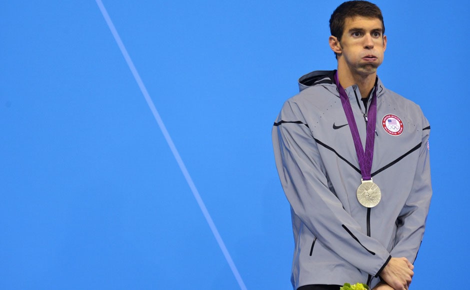 Michael Phelps of the U.S. puffs his cheeks after receiving his silver medal on the podium during the men's 200m butterfly victory ceremony. Toby Melville/Reuters Michael Phelps of the U.S. puffs his cheeks after receiving his silver medal on the podium during the men's 200m butterfly victory ceremony. Toby Melville/Reuters