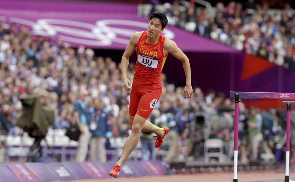China's Liu Xiang hops off the track after falling in a men's 110-meter hurdles heat during the athletics in the Olympic Stadium. AP China's Liu Xiang hops off the track after falling in a men's 110-meter hurdles heat during the athletics in the Olympic Stadium. AP