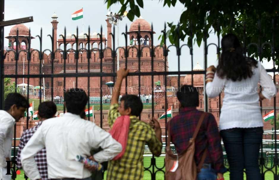 Tourists gaze at the Red Fort which has been readied for the Independence Day function. Naresh Sharma/Firstpost Tourists gaze at the Red Fort which has been readied for the Independence Day function. Naresh Sharma/Firstpost