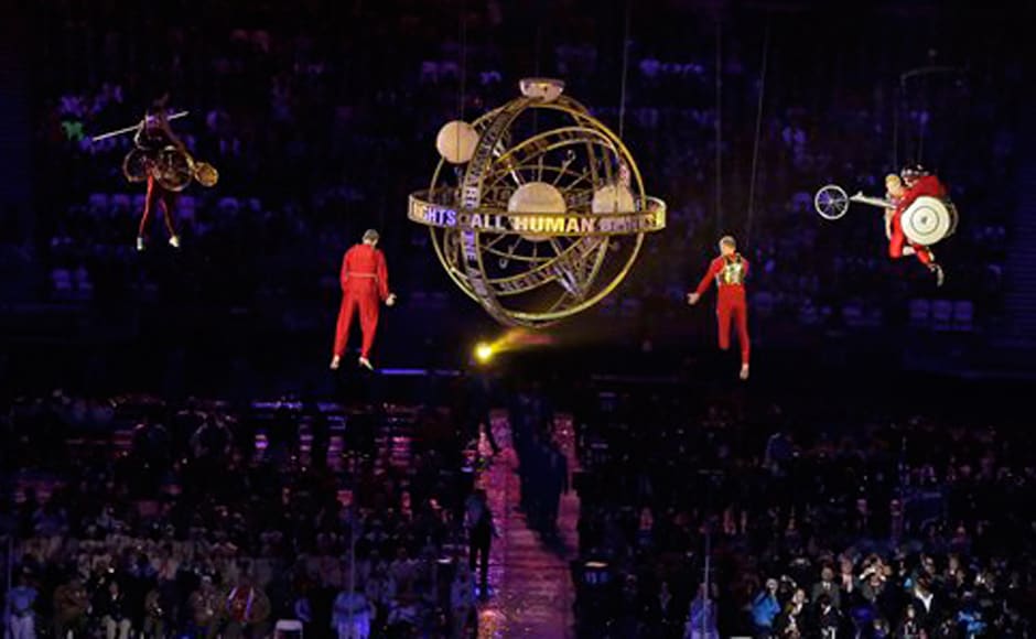 Performers race suspended in mid-air during the Opening Ceremony. AP Performers race suspended in mid-air during the Opening Ceremony. AP