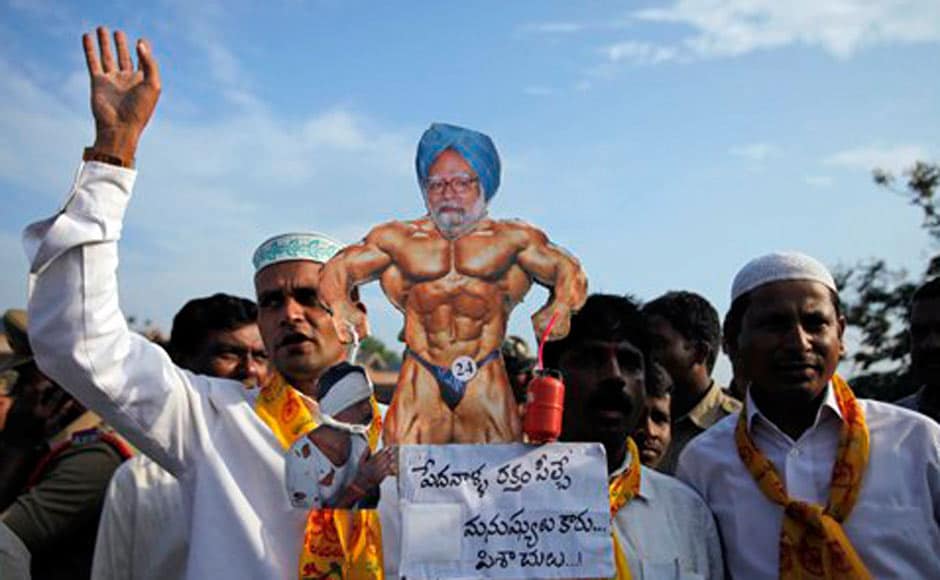 TDP activists carry a caricature of Prime Minister Manmohan Singh with the words “the blood suckers are not human beings but devils” during a protest at a bus station in Hyderabad. AP TDP activists carry a caricature of Prime Minister Manmohan Singh with the words “the blood suckers are not human beings but devils” during a protest at a bus station in Hyderabad. AP