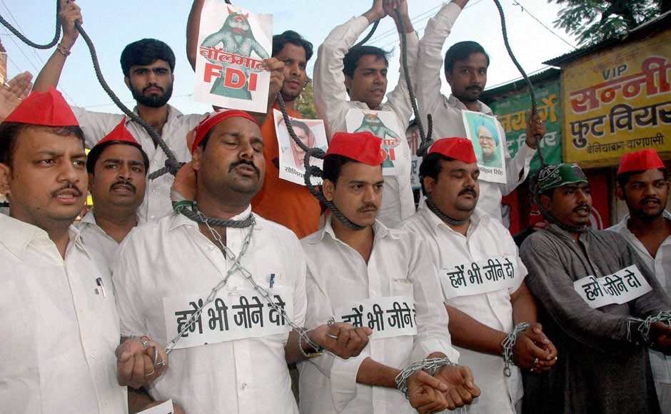 Activists of Samajwadi Party enact hanging during a protest against FDI in retail in Varanasi. PTI Activists of Samajwadi Party enact hanging during a protest against FDI in retail in Varanasi. PTI