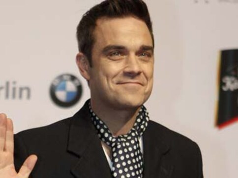 Pop star Robbie Williams becomes a dad