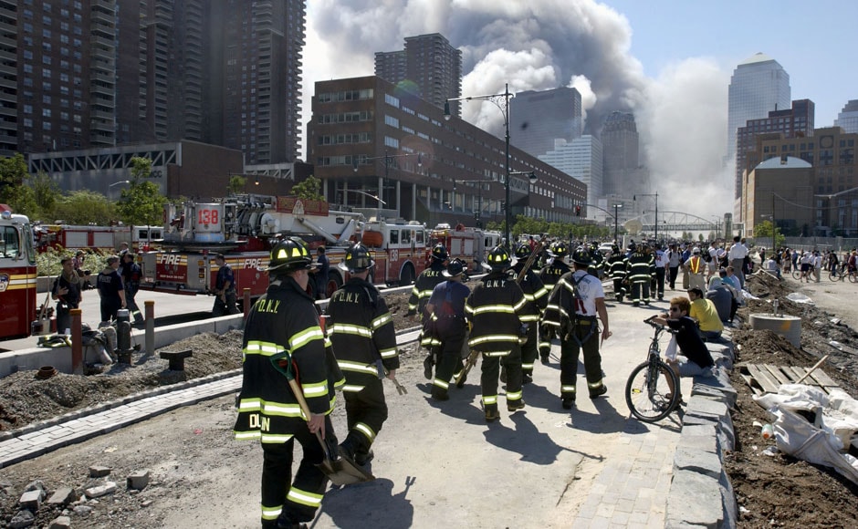 <br />Fireman heading south on the West Side Highway towards the remains of the World Trade Center where smoke continued hours after the colapse. Streets of lower Manhattan with fireman, police, and rescue crews after the colapse of the World Trade Center after being hit by two airplanes on 11 September 2001. Gabe Palacio/ImageDirect <br />Fireman heading south on the West Side Highway towards the remains of the World Trade Center where smoke continued hours after the colapse. Streets of lower Manhattan with fireman, police, and rescue crews after the colapse of the World Trade Center after being hit by two airplanes on 11 September 2001. Gabe Palacio/ImageDirect
