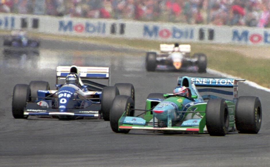 A whole season of controversies wasn't enough for Schumi before he won his first world title. Here he is, jostling with Damon Hill in the final race of the 1994 season. Both men retired from the race and the German kept his one-point lead. Getty Images A whole season of controversies wasn't enough for Schumi before he won his first world title. Here he is, jostling with Damon Hill in the final race of the 1994 season. Both men retired from the race and the German kept his one-point lead. Getty Images