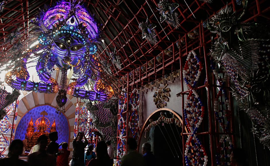 Devotees throng inside an illuminated pandal goddess Durga in Kolkata during the Durga Puja Festival. Bikas Das/AP Devotees throng inside an illuminated pandal goddess Durga in Kolkata during the Durga Puja Festival. Bikas Das/AP