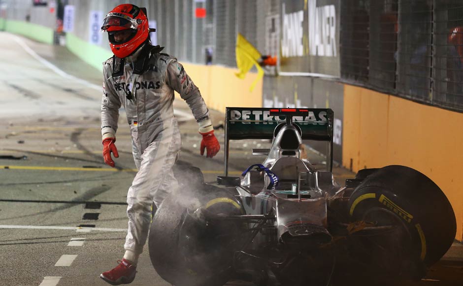Stomping away: After his comeback, Schumi could hardly emulate his former success. Here he is, walking back after a crash at the Singapore Grand Prix. Getty Images Stomping away: After his comeback, Schumi could hardly emulate his former success. Here he is, walking back after a crash at the Singapore Grand Prix. Getty Images