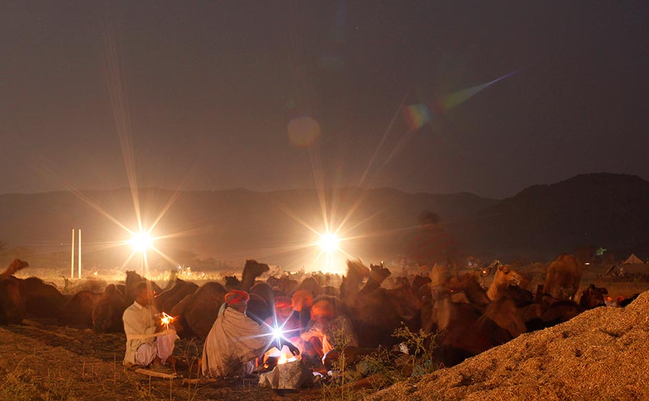 Camels herders prepare food at the Pushkar Fair in Pushkar. Rajesh Kumar Singh/AP Camels herders prepare food at the Pushkar Fair in Pushkar. Rajesh Kumar Singh/AP