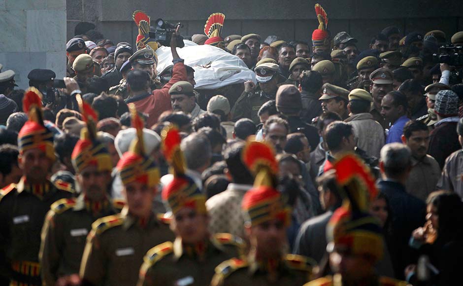 The body of constable Subhash Tomar is brought for cremation in New Delhi. Tomar was injured in Sunday's clashes with people protesting against the brutal gang-rape of a woman on a moving bus died in hospital. Mustafa Quraishi/AP The body of constable Subhash Tomar is brought for cremation in New Delhi. Tomar was injured in Sunday's clashes with people protesting against the brutal gang-rape of a woman on a moving bus died in hospital. Mustafa Quraishi/AP