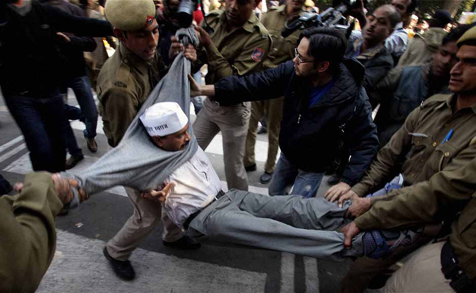 Police drag away AAP leader Arvind Kejriwal from outside Chief Minister Sheila Dikshit's residence during a protest against demolition of houses at Shaheen Bagh, in New Delhi. Vijay Verma/PTI Police drag away AAP leader Arvind Kejriwal from outside Chief Minister Sheila Dikshit's residence during a protest against demolition of houses at Shaheen Bagh, in New Delhi. Vijay Verma/PTI
