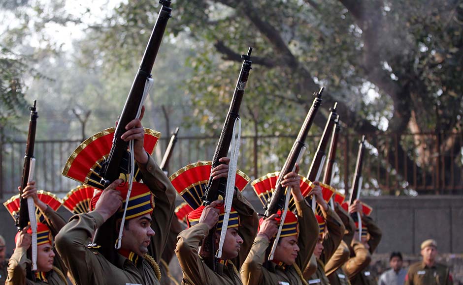 Policemen fire in the air during the cremation of their colleague Subhash Tomar in New Delhi. Mustafa Quraishi/AP Policemen fire in the air during the cremation of their colleague Subhash Tomar in New Delhi. Mustafa Quraishi/AP
