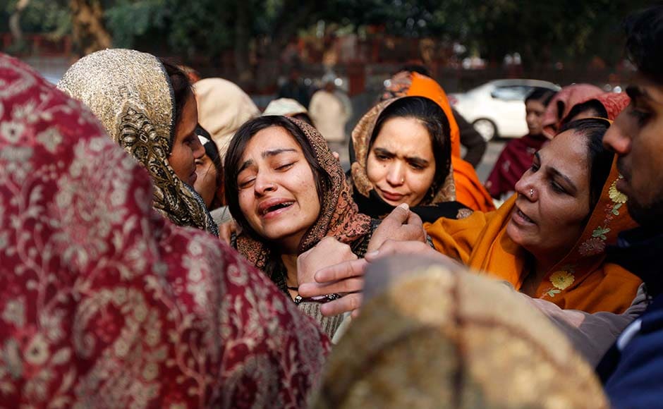 Relatives of policeman Subhash Tomar grieve as his body is brought for cremation in New Delhi. Mustafa Quraishi/AP Relatives of policeman Subhash Tomar grieve as his body is brought for cremation in New Delhi. Mustafa Quraishi/AP