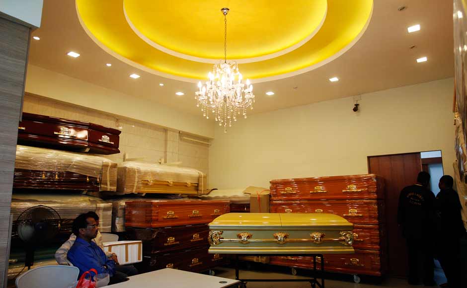 Indian High Commission officials at a funeral parlour in Singapore where the Delhi gangrape victim was taken for embalming. Reuters Indian High Commission officials at a funeral parlour in Singapore where the Delhi gangrape victim was taken for embalming. Reuters