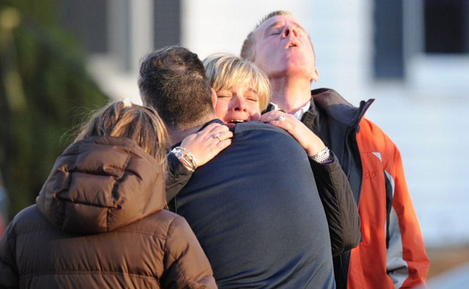 Parents comfort each other after the horrific shootout in the elementary school in Sandy Hook Elementary School in Newtown, Connecticut, northeast of New York City. AFP Parents comfort each other after the horrific shootout in the elementary school in Sandy Hook Elementary School in Newtown, Connecticut, northeast of New York City. AFP