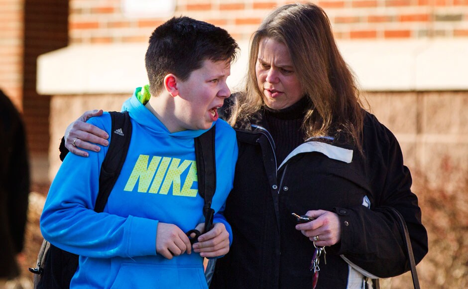 A young boy breaks down as his mother tries to comfort him in the school premises that witnessed one of the most horrific school shootouts in US history. Reuters. A young boy breaks down as his mother tries to comfort him in the school premises that witnessed one of the most horrific school shootouts in US history. Reuters.