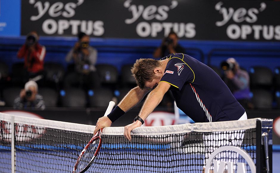 Switzerland's Stanislas Wawrinka rests on the net after losing his fourth round match against Serbia's Novak Djokovic at the Australian Open tennis championship in Melbourne. Andrew Brownbill/AP Switzerland's Stanislas Wawrinka rests on the net after losing his fourth round match against Serbia's Novak Djokovic at the Australian Open tennis championship in Melbourne. Andrew Brownbill/AP