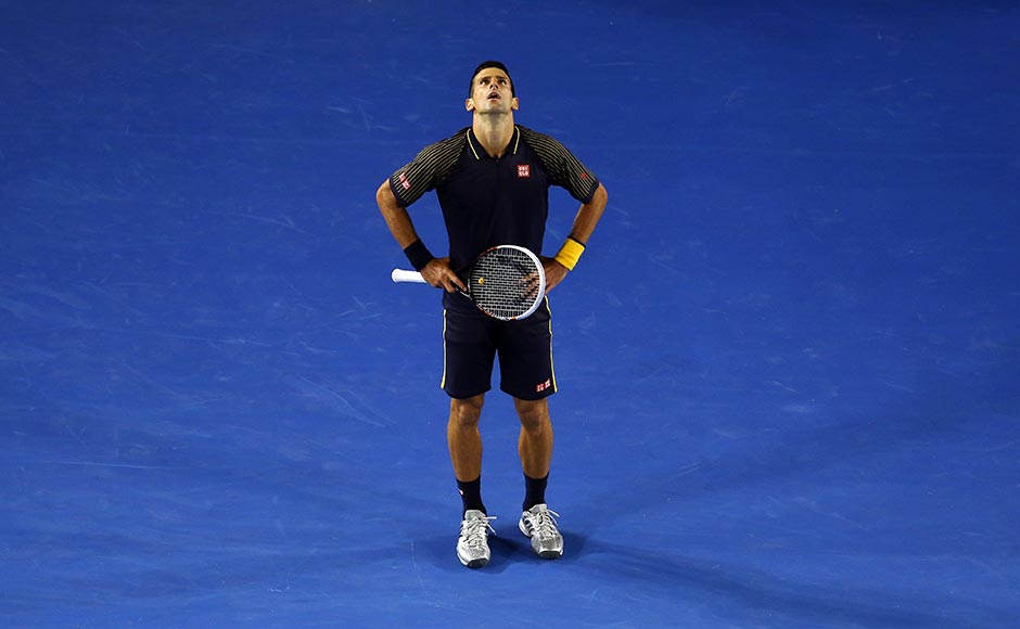 Novak Djokovic of Serbia looks to the sky in frustration in his fourth round match against Stanislas Wawrinka of Switzerland . Julian Finney/Getty Images Novak Djokovic of Serbia looks to the sky in frustration in his fourth round match against Stanislas Wawrinka of Switzerland . Julian Finney/Getty Images