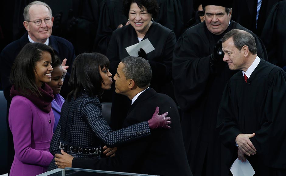 President Barack Obama kisses his wife Michelle after the ceremonial swearing-in at the US Capitol during the 57th Presidential Inauguration in Washington. Paul Sancya/AP President Barack Obama kisses his wife Michelle after the ceremonial swearing-in at the US Capitol during the 57th Presidential Inauguration in Washington. Paul Sancya/AP