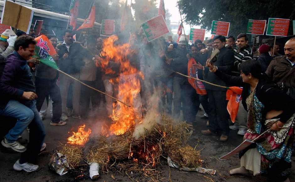 BJP workers burn an effigy of Union Home Minister Sushil Kumar Shinde in Lucknow during a protest over his controversial remarks on Thursday. PTI BJP workers burn an effigy of Union Home Minister Sushil Kumar Shinde in Lucknow during a protest over his controversial remarks on Thursday. PTI
