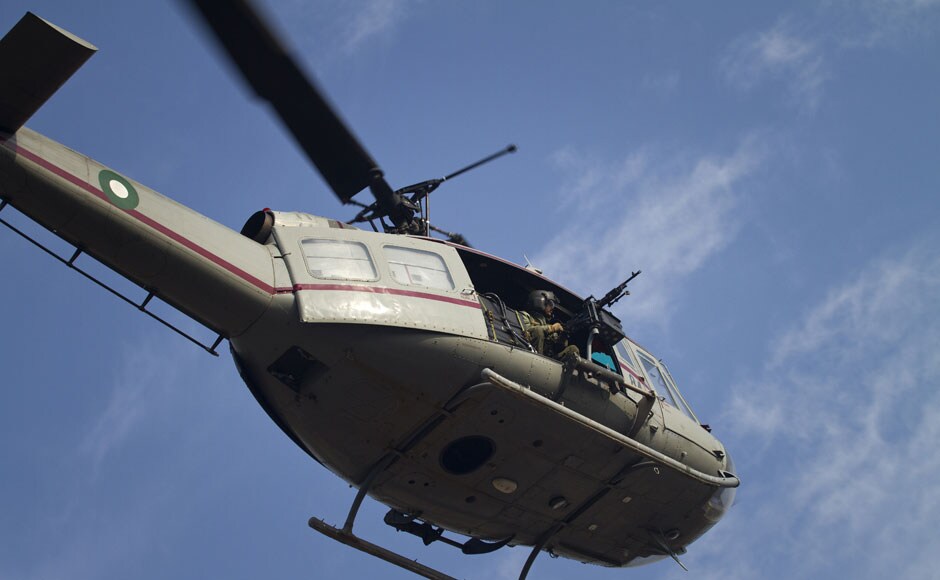 An army helicopter monitors the protest march. AP An army helicopter monitors the protest march. AP