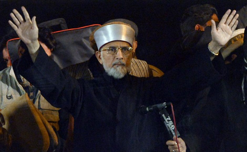 Qadri gestures upon his arrival at the protest march. AFP Qadri gestures upon his arrival at the protest march. AFP